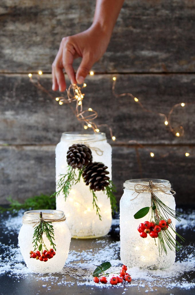 https://www.apieceofrainbow.com/wp-content/uploads/2018/10/DIY-snow-frosted-Christmas-mason-jars-crafts-decorations-wedding-centerpiece-winter-farmhouse-mason-jar-lights-apieceofrainbow-9.jpg
