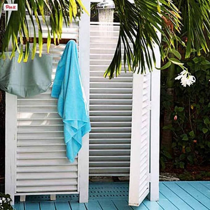Coastal style white shutter outdoor shower enclosure