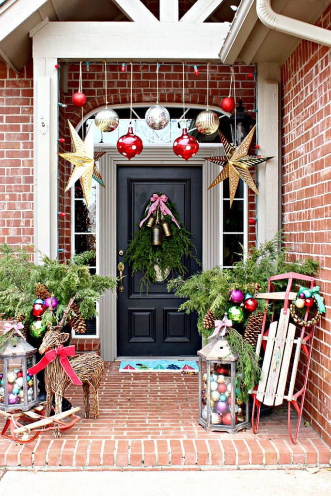 Christmas decorating steps with vintage style galvanized tin vases
