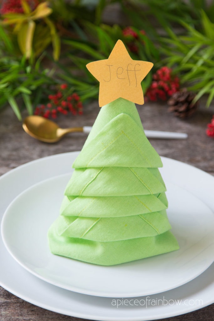 https://www.apieceofrainbow.com/wp-content/uploads/2020/12/DIY-Christmas-tree-napkin-folding-ideas-easy-table-settings-decorations-holiday-crafts-how-to-decorate-napkins-apieceofrainbow-1b-683x1024.jpg